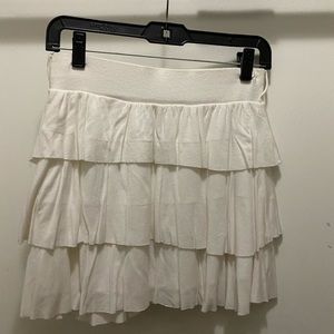 white ruffled short skirt